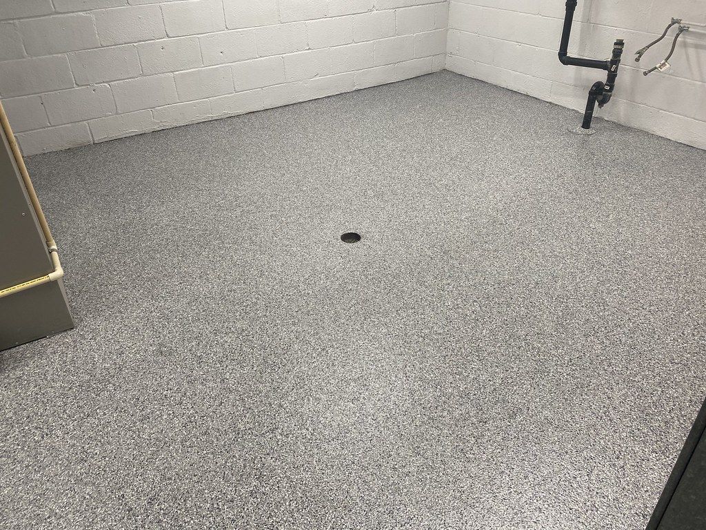 Close-up of flake concrete coating detail after professional prep in Cedar Rapids