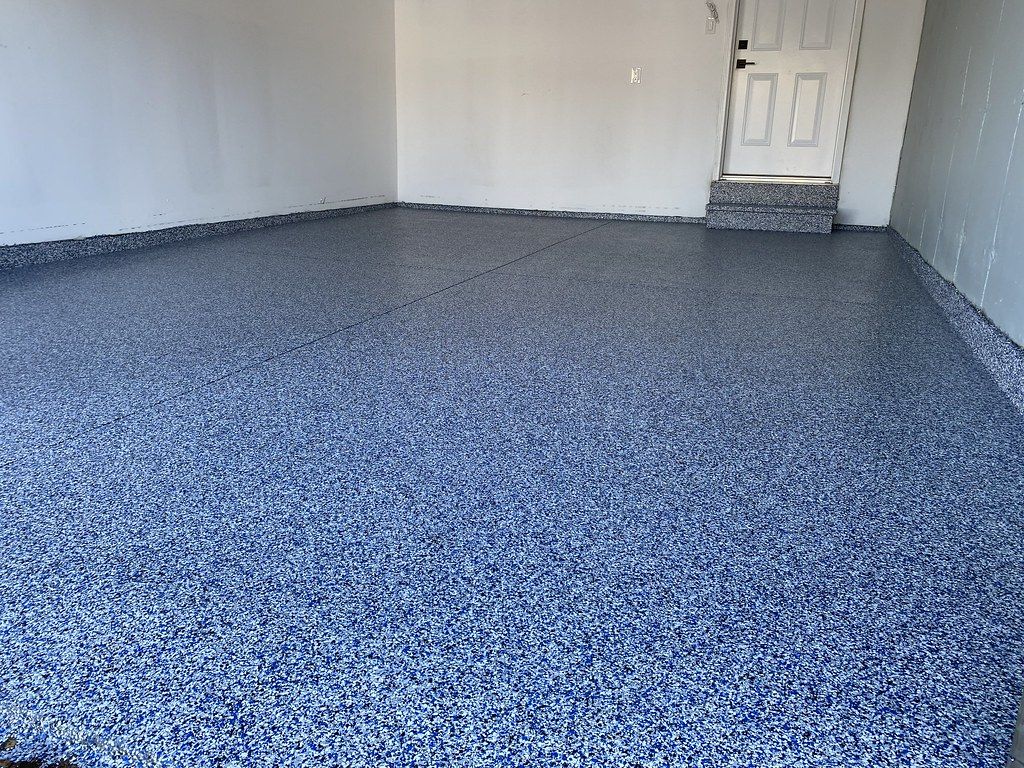 Durable flake epoxy garage coating in Cedar Rapids ready for polyaspartic topcoat systems